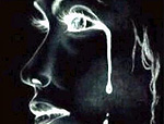 a photo negative image of a woman crying