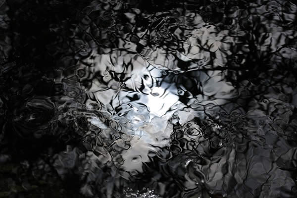 the play of shadows and light on the surface of water