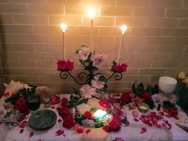 The Sisters of the Cauldron, our women's mystery group, created a temple for the Goddess in the chapel, where we met to prepare the waters and oils that blessed the Earth around the Maypole, and to prepare the Queen, and her attendants, the Besomkeeper and Cauldronbearer. Photo by Heron Michelle