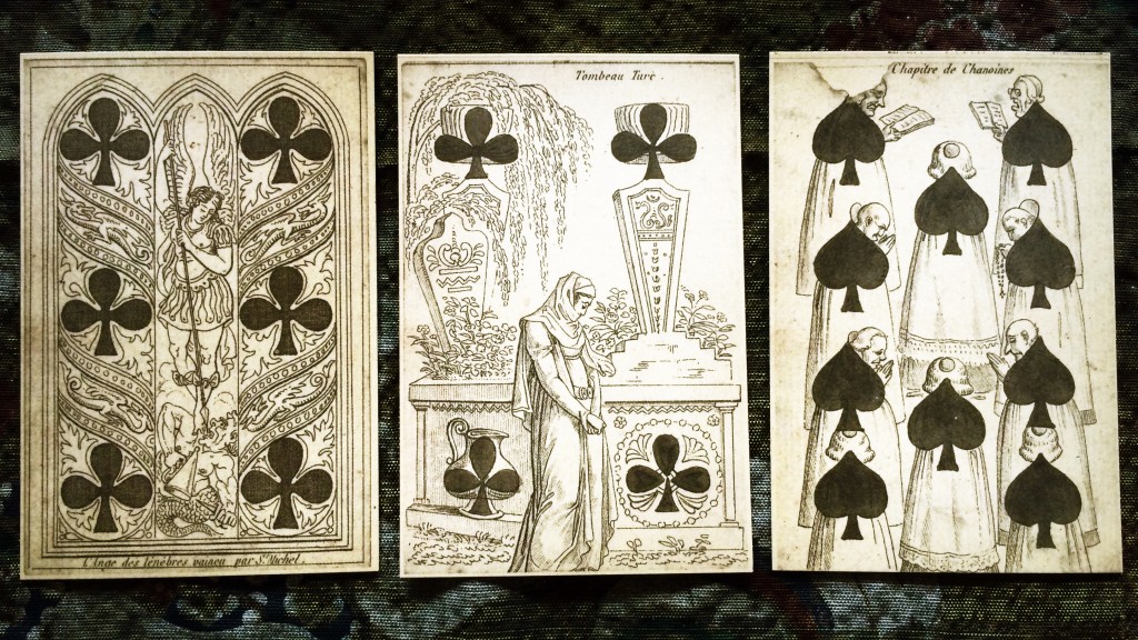 three cards, the six and four of clubs and the nine of spades, side by side on a table