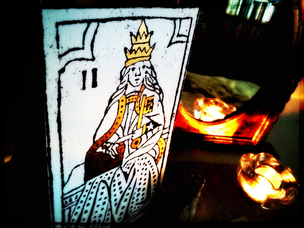 a tarot card, the Empress, on a table