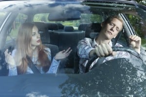 Young couple arguing in car