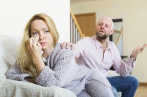 Man consoling the depressed woman