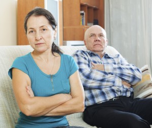 Upset mature woman against husband
