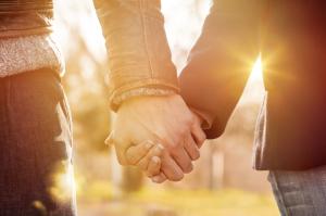 Couple holding hands