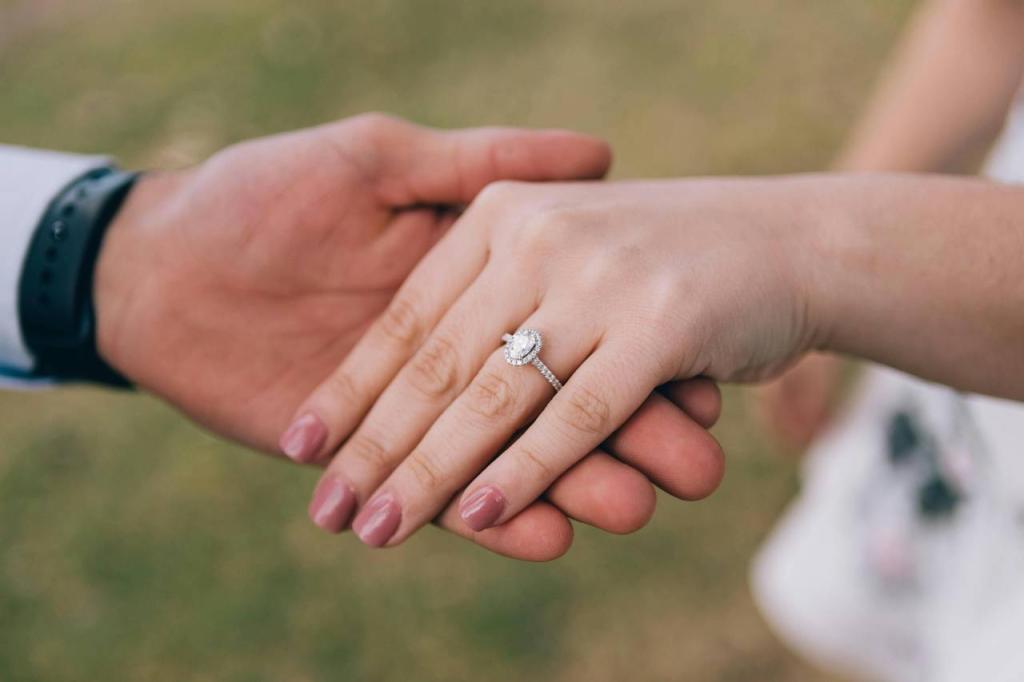 two hands one with an engagement ring.