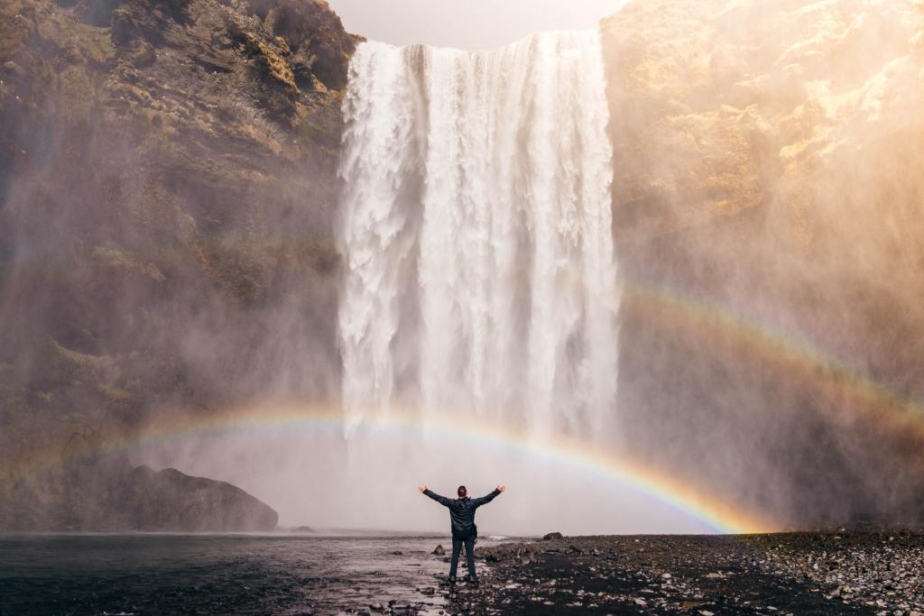 man looking at waterfall measuring life