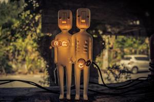 Sculptures holding lightbulbs