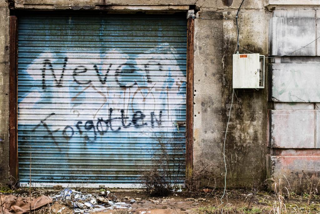 Metal door with graffiti on it.