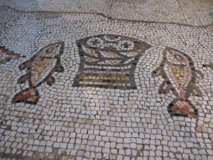 Mosaic of loaves and fishes at the Church of the Multiplication in the Holy Land Flickr Creative Commons Copyright James Emery