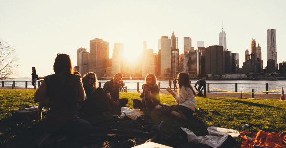 people sitting on city lawn