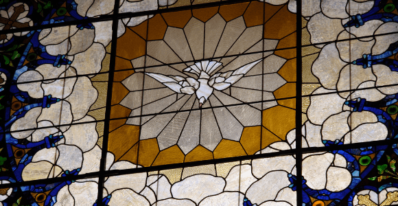 stained glass window of spirit as dove