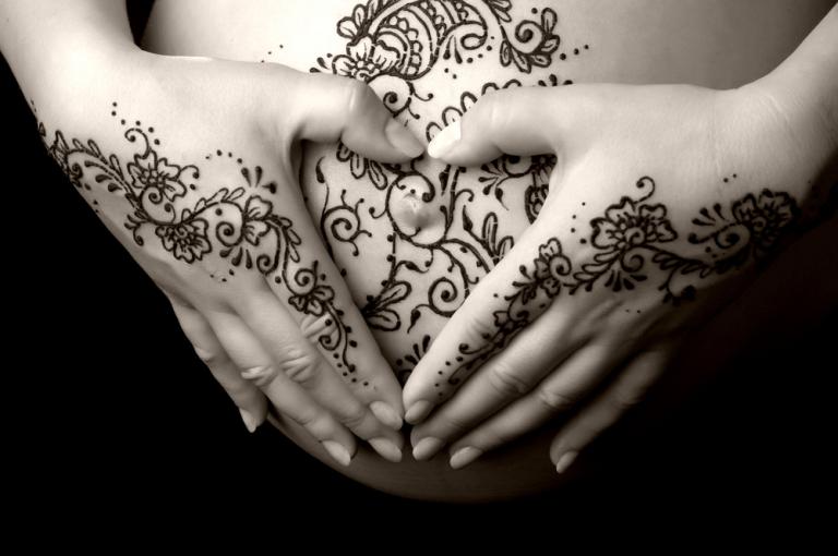 Henna belly tattoo - image by Katrina Elena via Shutterstock