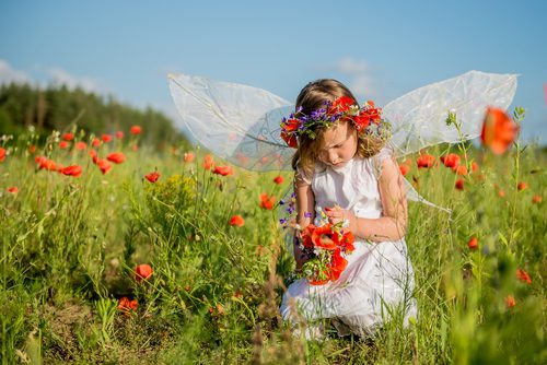 Girl on the poppy field by RadVila. Image via Shutterstock.