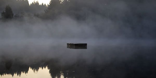 a floating dock in the middle of a lack