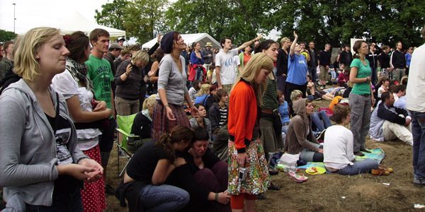 Christians praying and worshiping at a festival. Similar energy, but much less expensive setting then Bethel. Photo by the author.