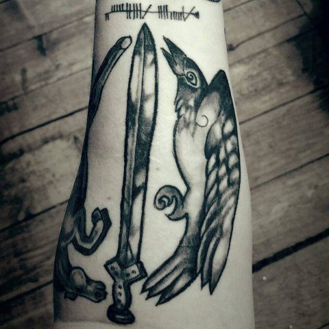 A second devotional tattoo to Macha, featuring a horse, blade, and hooded crow.