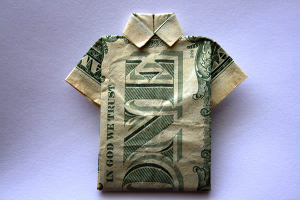 a dollar bill folded into the shape of a shirt
