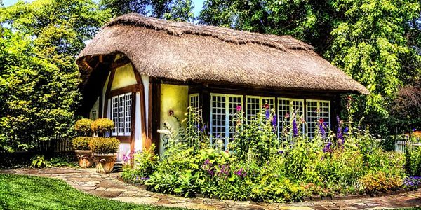 a cottage with a thatched roof