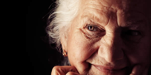 Portrait of a happy senior woman smiling at the camera.