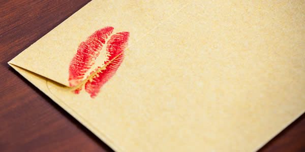 an envelop with a kiss-mark in lipstick on it