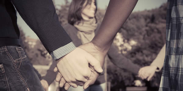 Multiracial Young People Holding Hands in a Circle