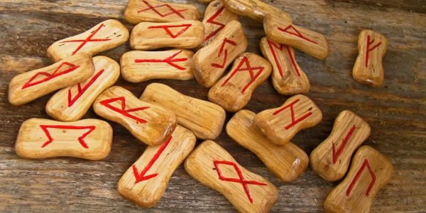 a series of runes on wooden chips