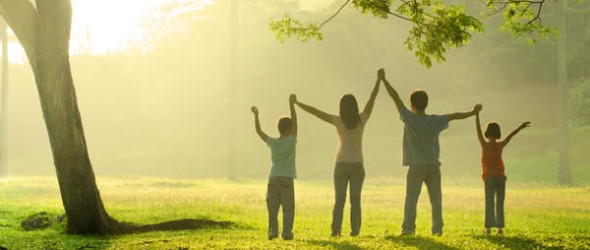 a family in the park during a beautiful sunrise, backlight
