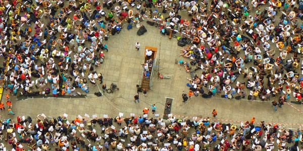 a large group of people protesting in the streets