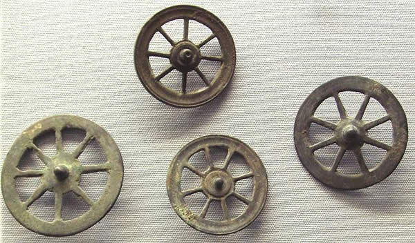 a series of four spoked wheels
