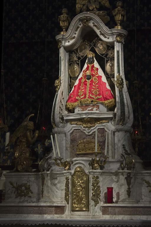 an ornate altar in a Catholic church depicting Christ and a Black Madonna