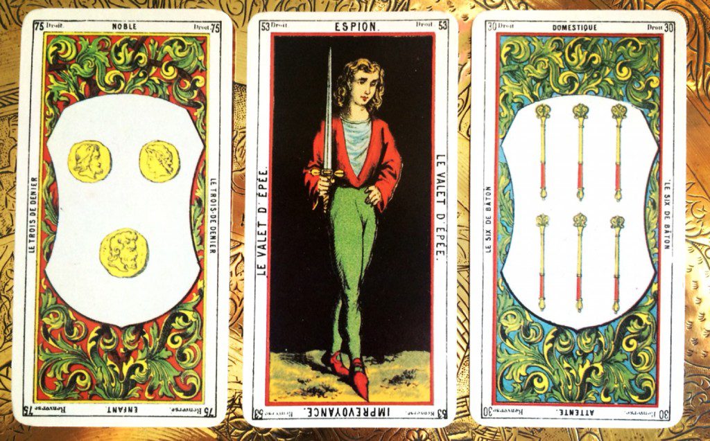 three cards face up -- the outer most cards are blurry but the center, focused card depicts a young woman holding a sword