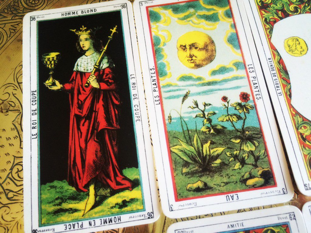 a close-up of a tarot spread depicting portions of a number of different cards