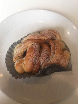 a sugar coated baked pastry on a plate