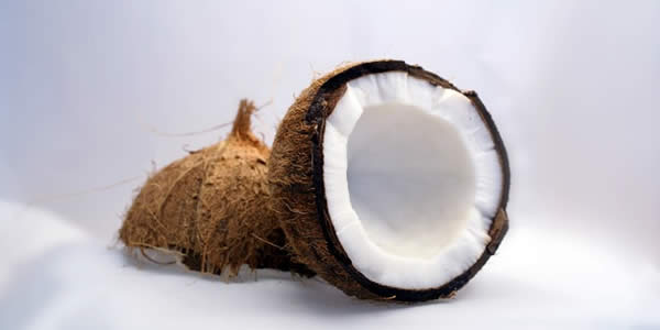 a photograph of a coconut that's split in two