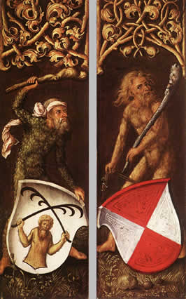 two hairy, male figures standing behind shields