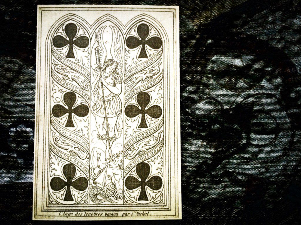 a close-up photograph of the six of clubs