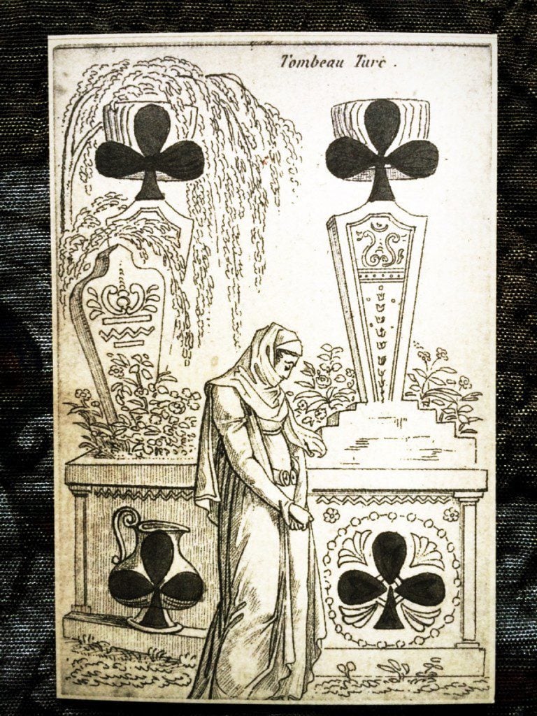 a detailed photograph of the four of clubs