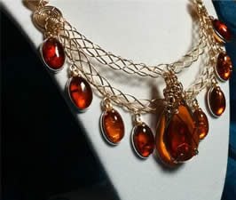 A handmade necklace of amber, goldfilled wire, goldfilled chain, sterling silver