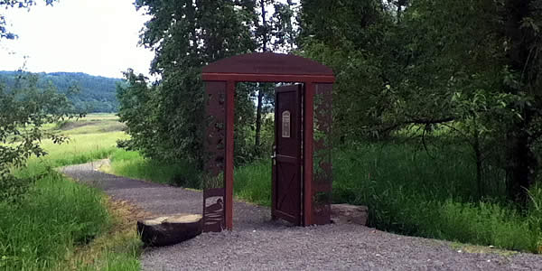 a gate across a path in a park
