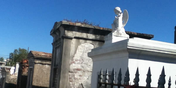 above ground tombs, common in New Orleans, under a blue sky