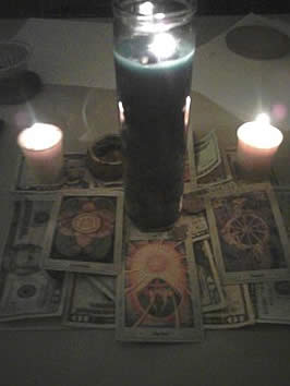 candles burning among tarot cards