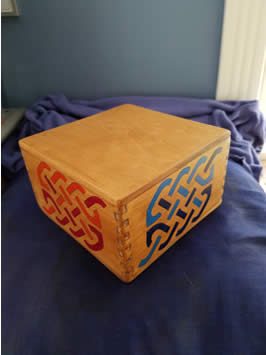 a finished, painted, handcrafted wooden box