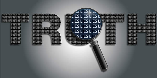 the word "truth" over which a magnifying glass reveals the word "lies"