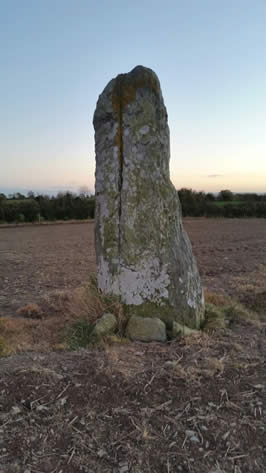 a solitary standing stone split down the middle