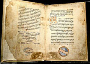 an open, illuminated manuscript 