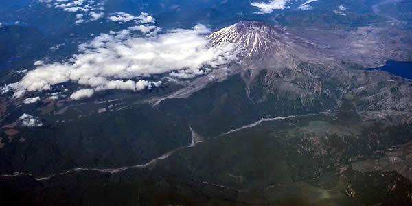 a view of mount saint helens, an active volcano, from a commercial airliner