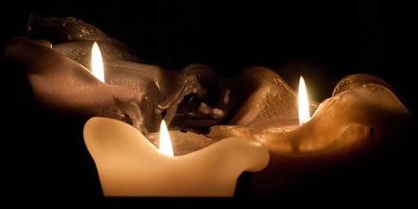 a photograph of three lit candles