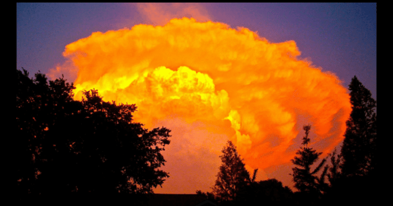 Fiery sunlight on a bank of clouds.