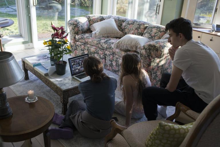 A family sits for a remote Zoom shiva, the traditional Jewish time of mourning, New Canaan, Connecticut, April 11, 2020